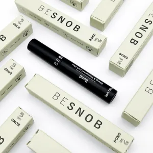 BE SNOB Lash Bond promotional display with multiple packages