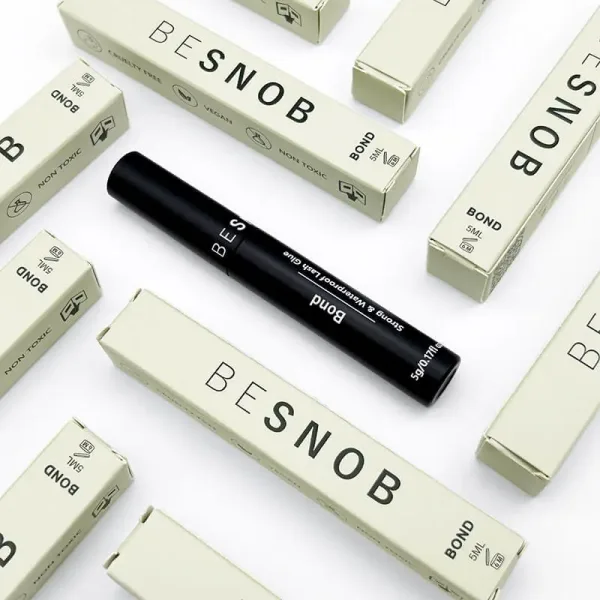 BE SNOB Lash Bond promotional display with multiple packages