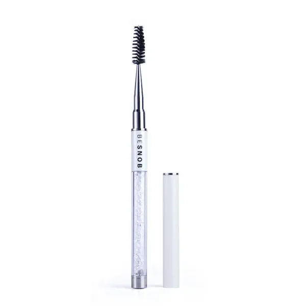 BE SNOB Lash Brush opened showing the spoolie brush and protective cap
