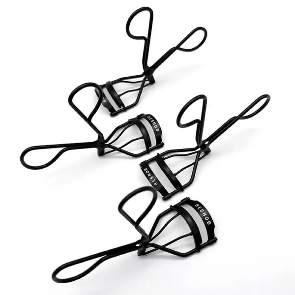 BE SNOB Professional Eyelash Curlers arranged in an angled composition